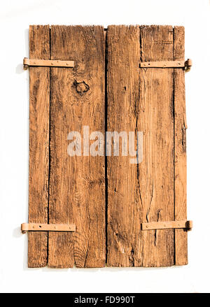 Old wooden shutters formed from cracked aces white isolated. Stock Photo