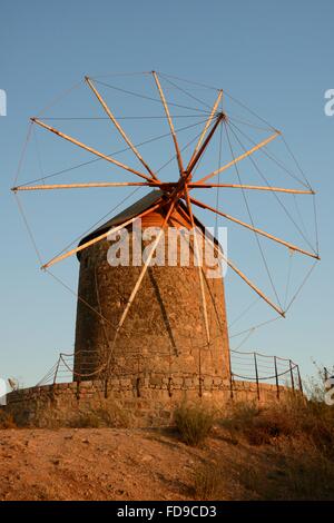 Restored windmill of the Monastery of St. John the Theologian at sunset, Chora, Patmos, Dodecanese Islands, Greece. Stock Photo