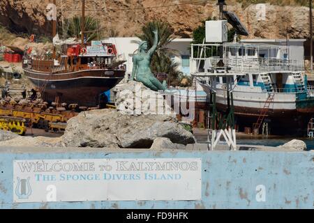 Mermaid statue on the Quay at Pothia town harbour, Kalymnos, Dodecanese Islands, Greece. Stock Photo