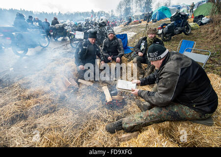 Thurmansbang, Germany. 29th Jan, 2016. Participants of the 'Elefantentreffen' (lit. Elephant meeting) motorcyle meting sit around a bonfire in Thurmansbang, Germany, 29 January 2016. Organizers expect about 4,000 bikers at the 60th Elefantentreffen of the federal association of motorcyclists (BVDM). Photo: Armin Weigel/dpa/Alamy Live News Stock Photo