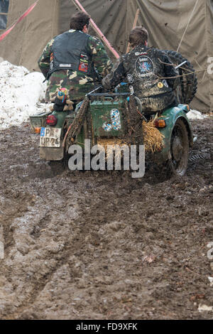 Thurmansbang, Germany. 29th Jan, 2016. A man steers his motorcycles through the mud at the venue of the 'Elefantentreffen' (lit. Elephant meeting) motorcyle meting in Thurmansbang, Germany, 29 January 2016. Organizers expect about 4,000 bikers at the 60th Elefantentreffen of the federal association of motorcyclists (BVDM). Photo: Armin Weigel/dpa/Alamy Live News Stock Photo