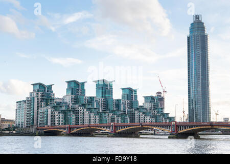 Modern apartment buildings and skyscrapers on the South Bank of the River Thames London at St George's Wharf Vauxhall Bridge Stock Photo