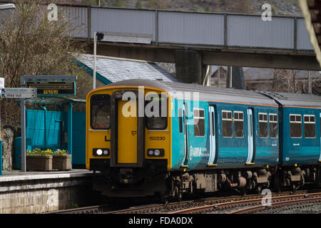 Arriva Trains Wales ATW Class 150 sprinter train, 150230 waits for departure time at Blaneau Ffestiniog BFF Snowdonia with a train for Llandudno. Stock Photo