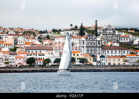 View from the sea of a Yatch leaves Horta City, Faial Island, Azores, Portugal Stock Photo