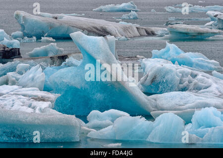 Drifting blue icebergs in the Jökulsárlón glacier lagoon, Southern Region, Iceland Stock Photo