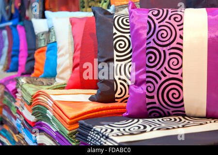 Luxury Thai silk cushions and pillowcases on show at market. Stock Photo