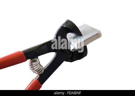 Image of a tile nipper for cutting ceramic tiles. Stock Photo