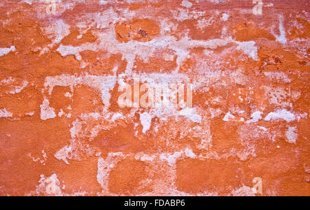 abstract image of with crumbling paint and underlying bricks showing through. Stock Photo