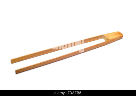a pair of new bamboo tongs on a white background Stock Photo