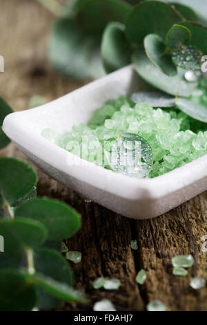 Green bath salt with fresh eucalyptus leaves Stock Photo