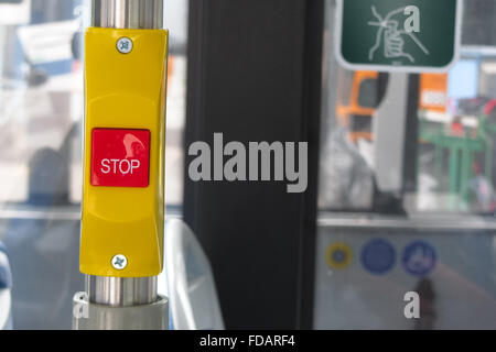 Stop on request button on bus Stock Photo