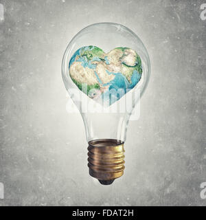 Glass light bulb and Earth planet inside. Elements of this image are furnished by NASA Stock Photo