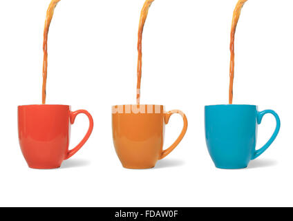 Studio shot of coffee pouring into three mugs Stock Photo