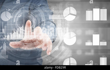 Businessman hand pushing business graph on touch screen interface Stock Photo
