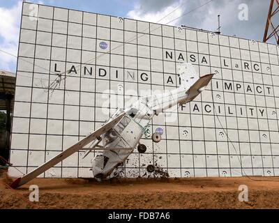 A Cessna 172 aircraft is dropped to the concrete from 82 feet at the Landing and Impact Research Facility at NASA's Langley Research Center July 29, 2015 in Hampton, Virginia. The test is to improve general aviation emergency locator beacons which often fail after a crash and are critical for search and rescue. Stock Photo