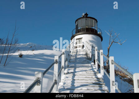 Snow covered stairway leads Owl's Head Light in Maine. Stock Photo