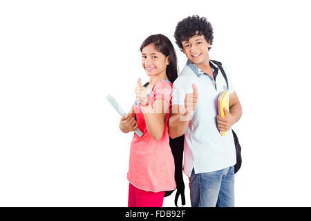 2 Teenagers Student College friends Back to back Standing Thumbs up Showing Stock Photo