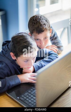 MODEL RELEASED. Two boys using a laptop computer Stock Photo - Alamy