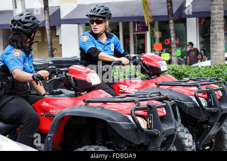 Miami Beach Florida,police,officer,policewoman,riding,ATV,uniform,FL151121127 Stock Photo