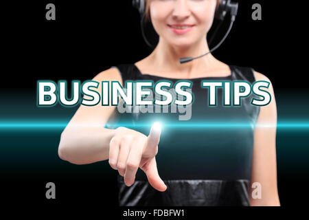 businesswoman, Focus on hand pressing Business Tips button. virtual screens, technology, internet concept. Stock Photo