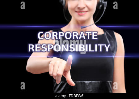 business, technology and networking concept - businesswoman pressing corporate responsibility button on virtual screens Stock Photo