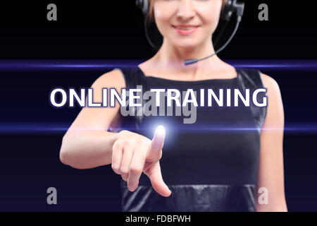business, technology, internet and networking concept - businesswoman pressing online training button on virtual screens Stock Photo