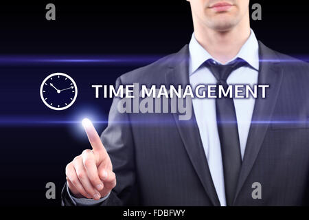 business, technology, networking concept - businessman pressing time management button on virtual screens Stock Photo