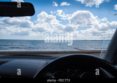 View from inside a car over the beach and sea at Exmouth Devon, England, UK. ++Property release can be made available++ Stock Photo