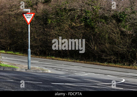 A Give Way road sign on an empty road. Stock Photo