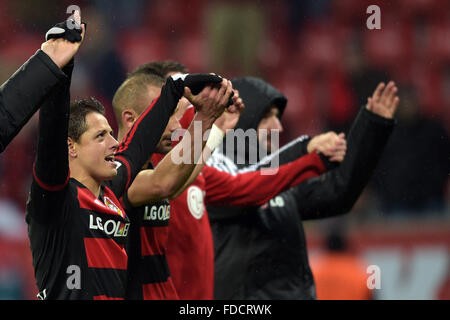 Leverkusen, Germany. 30th Jan, 2016. Leverkusen's Javier Hernandez (l) and teammates celebrate their victory after the German Bundesliga football match between Bayer Leverkusen and Hannover 96, at the BayArena in Leverkusen, Germany, 30 January 2016. PHOTO: FEDERICO GAMBARINI/DPA (EMBARGO CONDITIONS - ATTENTION: Due to the accreditation guidelines, the DFL only permits the publication and utilisation of up to 15 pictures per match on the internet and in online media during the match.) Credit:  dpa/Alamy Live News Stock Photo