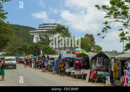 The cruise ship 'Carnival Spirit' docked at Port Vila, Vanuatu, dominates the quayside market. Stock Photo