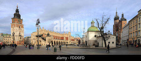 Krakow, Poland. 30th Jan, 2016. An overview of the Main Market Square with the historic town hall tower (l-r), the Cloth Hall and the twin-towered St. Mary's Church in Krakow, Poland, 30 January 2016. Krakow, the capital of Malopolska Province, lies on the the Vistula with its approximately 750,000 inhabitants in the south of Poland. The river itself flows through the middle of which was founded in the 13th century city. The historic town has been completely preserved and since 1978 set by the UNESCO on of World Cultural Heritage list. Krakow is one of the oldest cultural and scientific center Stock Photo