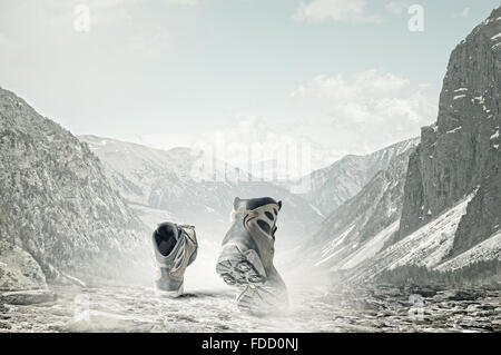 Pair of hikers boots walking on path Stock Photo