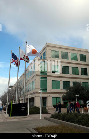 People are seen at Apple's corporate headquarters in Cupertino, California Stock Photo