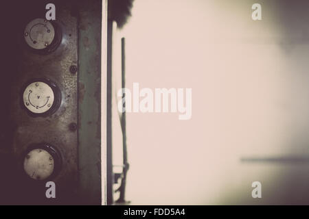 Color image of some buttons on a dirty old control panel. Stock Photo