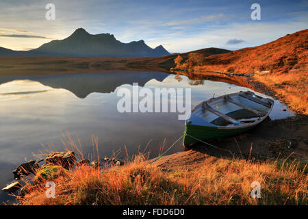 A boat on Loch Hakel near Tongue in North West Scotland, with Ben Loyal in the distance. Stock Photo