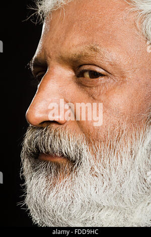 1 indian Senior Adult Man  Extreme face Seniors side pose  Looking-At-Camera Stock Photo