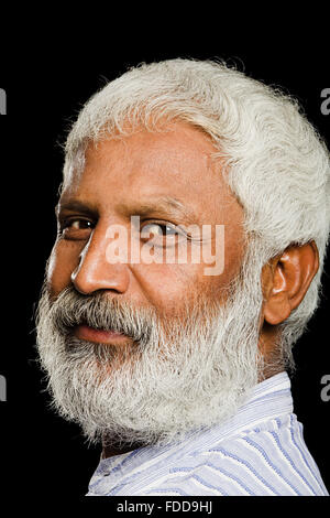 1 indian Senior Adult Man Extreme face side pose  smiling Looking-At-Camera Stock Photo