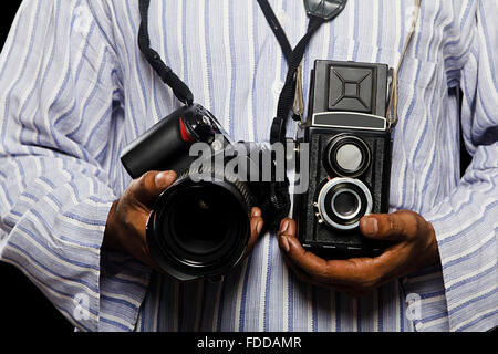 1 Adult Cameraman Holding Camera midsection Stock Photo