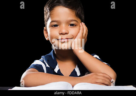 1 indian Kid Boy Student Reading Book Stock Photo