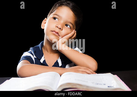 1 indian Kid Boy Student Reading Book Dreaming Stock Photo