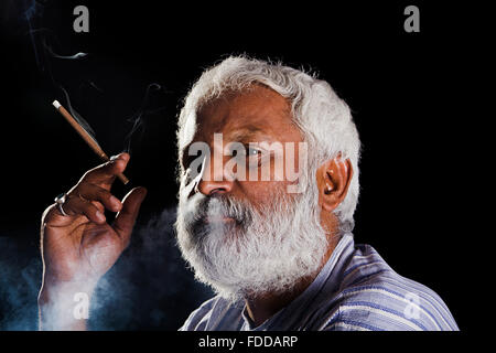 1 indian Senior Adult Man Smoking Cigarette Stock Photo