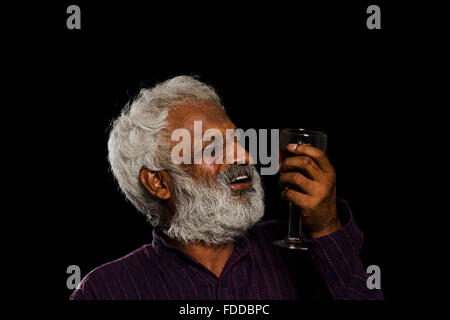 1 indian Senior Adult Man Alcohol Drinking Addiction Stock Photo