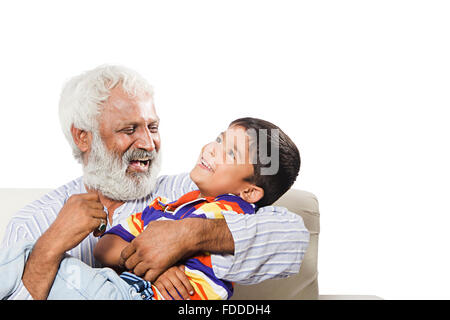 2 People GrandFather and Grandson sitting sofa fun Stock Photo