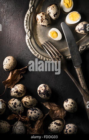 Rustic still life of Quail Eggs on silver salver Stock Photo