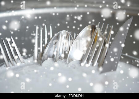 close up of dirty dishes washing in kitchen sink Stock Photo