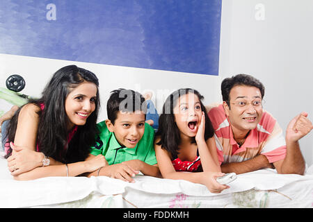 4 People Parents and Kid Bedroom Lying Down Entertainment Television Watching