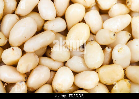 food background - peeled pine seeds close up Stock Photo