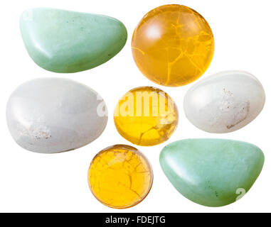 macro shooting of collection natural stones - various opal (fire, yellow, green, milky) gem stones isolated on white background Stock Photo