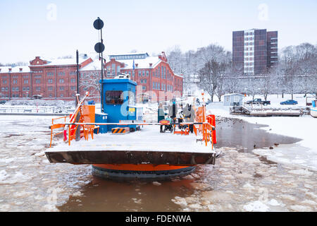 Turku, Finland - January 17, 2016: Ordinary passengers of Fori, light traffic ferry that has served the Aura River Stock Photo